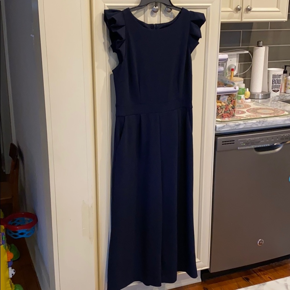 Navy flutter sleeve jumpsuit with pockets!